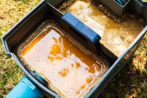 throwing away containers of grease /grease trap