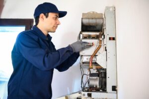 a technician installing a water heater